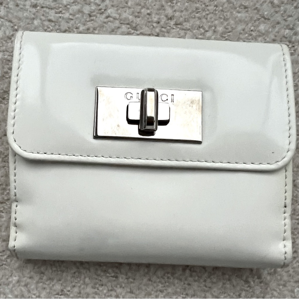 Tom Ford era white patent Gucci wallet with silver turn lock hardware .